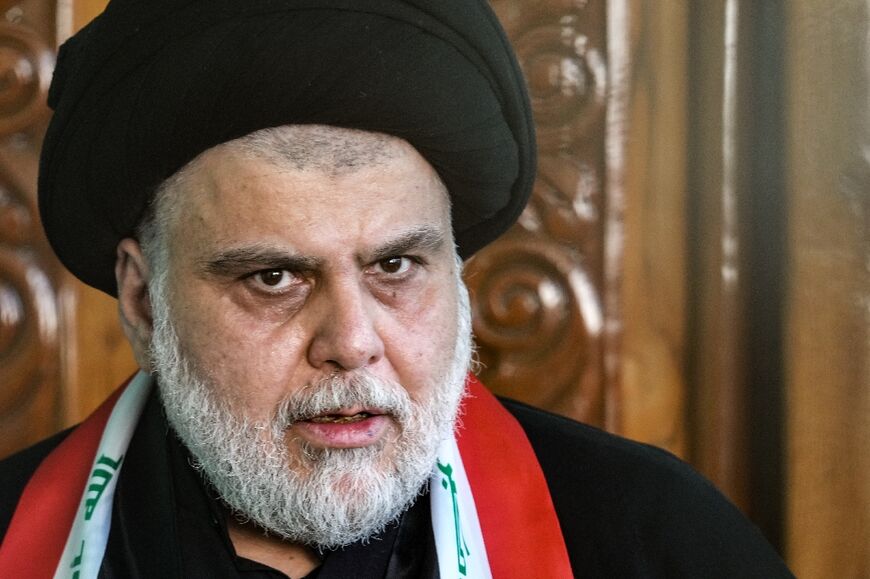 Cleric Moqtada Sadr speaking to reporters in the holy city of Najaf