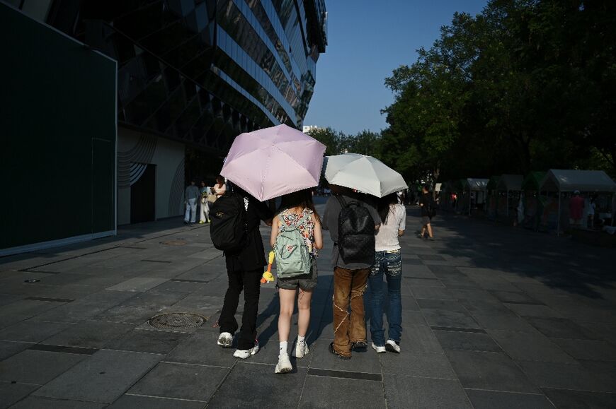 Umbrellas were ubiquitous in Beijing
