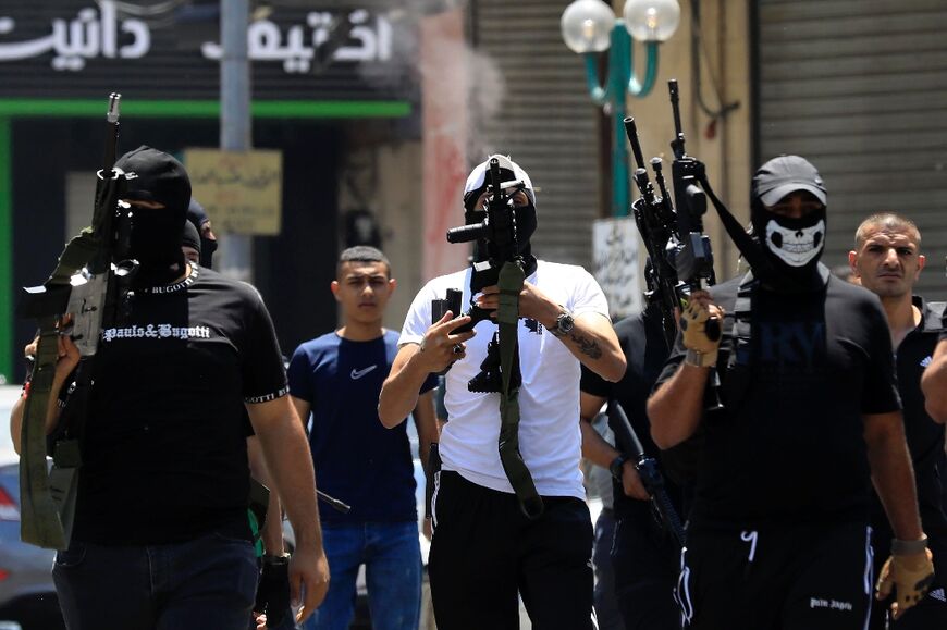Palestinian gunmen at the funeral of Khairi Shaheen and Hamza Maqbul, killed by Israeli forces in Nablus
