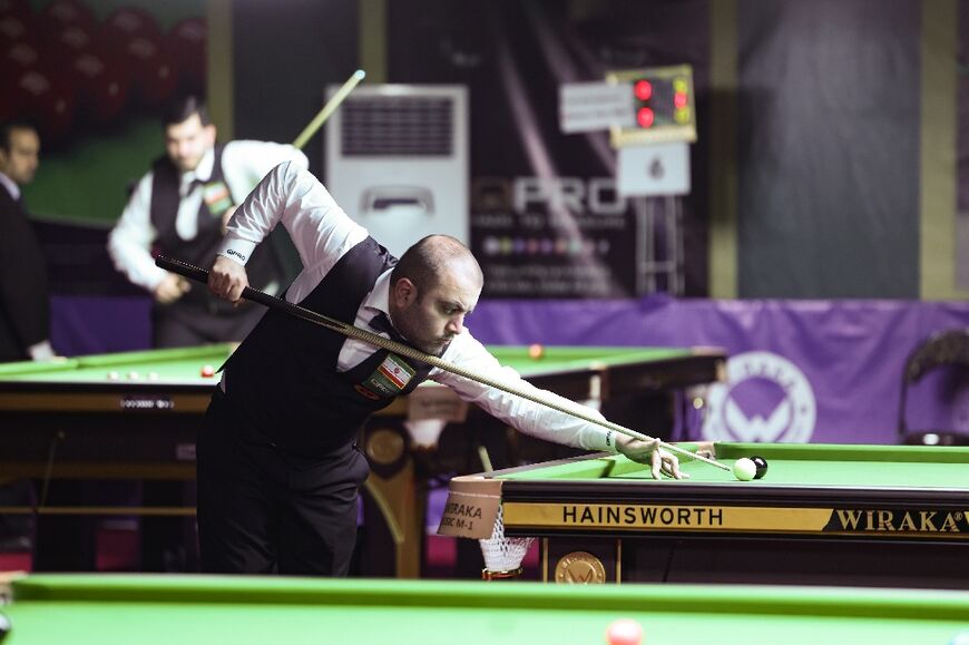 Iranian snooker player Amir Sarkhosh competes during the ACBS Asian 6 Reds Snooker Championship in Tehran on June 24, 2023