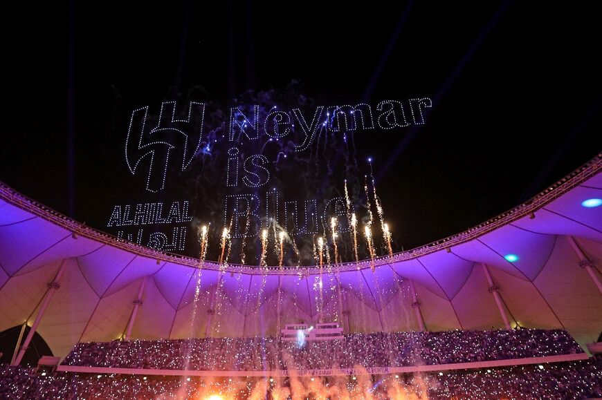 Neymar was greeted by fireworks, flame-throwers and a drone display at King Fahd International Stadium