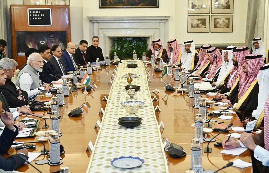 This photograph taken September 11, 2023 and released by the Indian Press Information Bureau shows Prime Minister Narendra Modi (center L) and his Saudi Arabian counterpart and Crown Prince Mohammed bin Salman (center R) holding talks in New Delhi