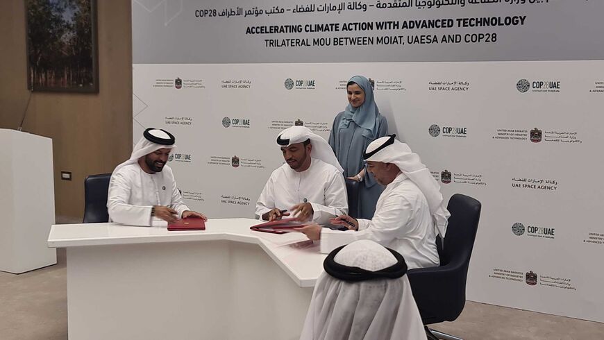 Undersecretary of the Ministry and Advanced Technology Omar Al Suwaidi (center), Director General of the UAE Space Agency Salem Butti Salem Al Qubaisi (left), and Director-General and Special Representative of the COP28 Majid Al Suwaidi (right) at the signing of an MoU between the three agencies.