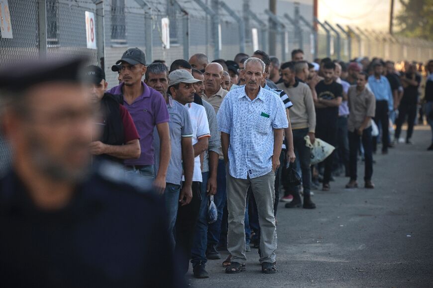 Palestinian workers gather at the Erez crossing between Israel and the Gaza Strip