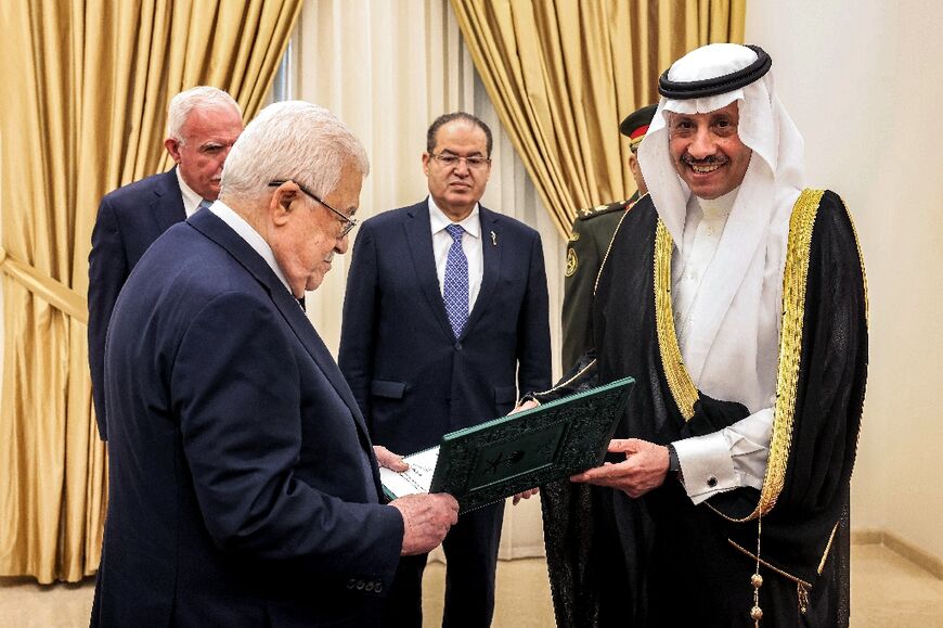 Palestinian president Mahmud Abbas (L) receiving the credentials of Nayef al-Sudairi(R), Saudi Arabia's non-resident ambassador to the Palestinians 