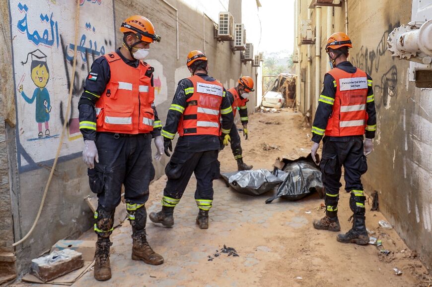 A Palestinian Civil Defence team works in Derna 