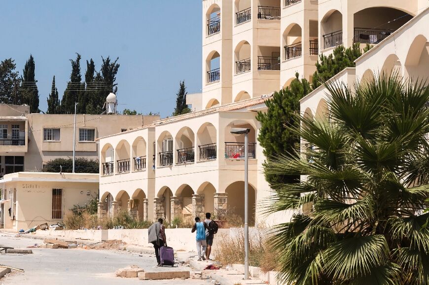 Years of friction around a condemned apartment complex near Paphos in Cyprus were followed by anti-migrant attacks