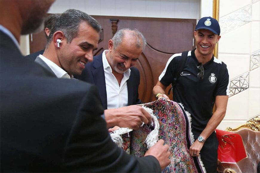 Ronaldo is gifted a Persian rug upon his arrival in Tehran