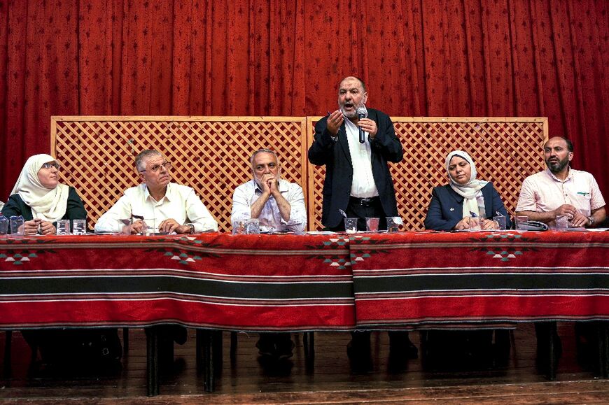 Tayseer Abu Sneineh, mayor of the occupied West Bank city of Hebron, discusses water shortages during a session at the municipality hall