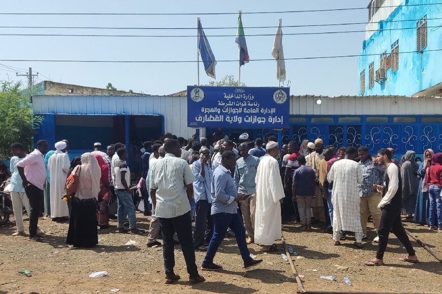 Sudanese queue outside a passport office in the eastern city of Gedaref -- one million people have already crossed borders to escape Sudan's war