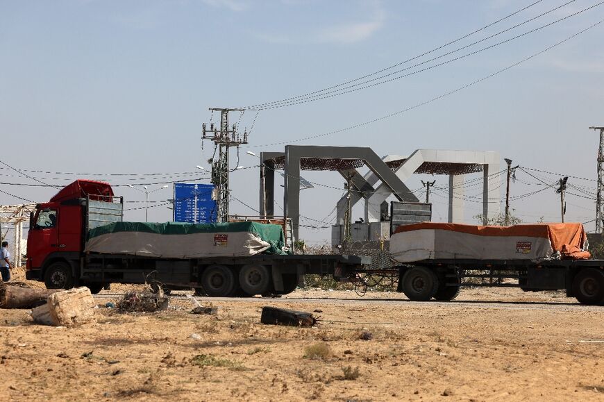 Lorries carrying humanitarian aid enter the Gaza Strip from Egypt via the Rafah border crossing 