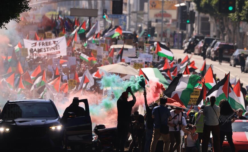 Thousands of demonstrators waving Palestinian flags and signs denouncing "Israeli apartheid" march in support of Palestinians in Los Angeles on October 14, 2023