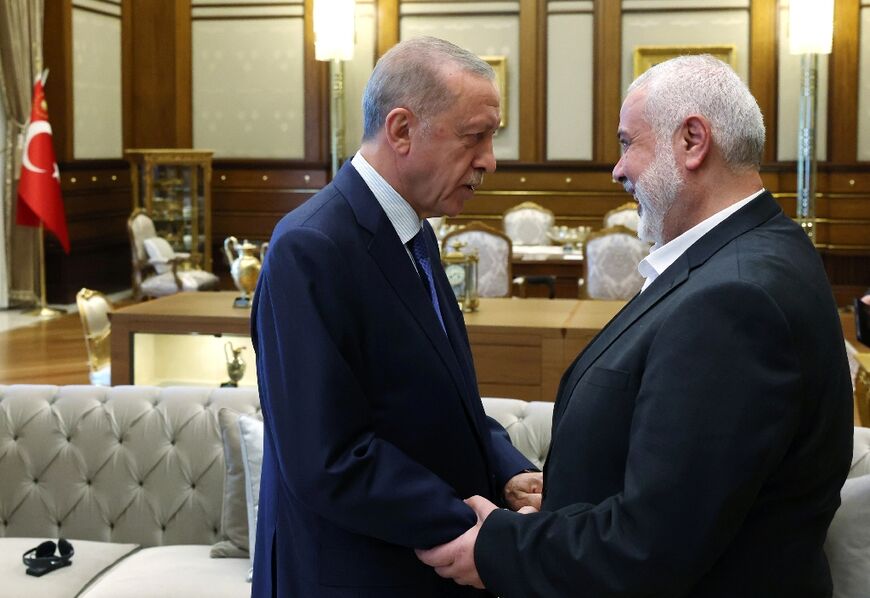 Turkish President Recep Tayyip Erdogan (L) met Hamas chief Ismail Haniyeh in July