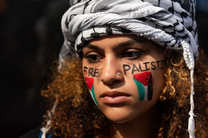 A Palestinian supporter attends a protest near the Consulate General of Israel in New York on October 9, 2023
