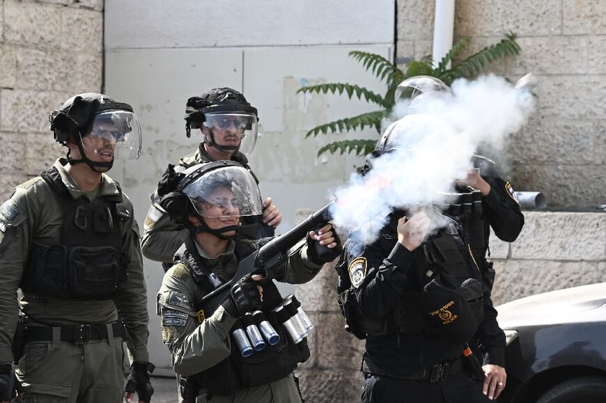 With tensions high because of the war, Israeli forces fire tear gas to stop some people from entering the Old City 