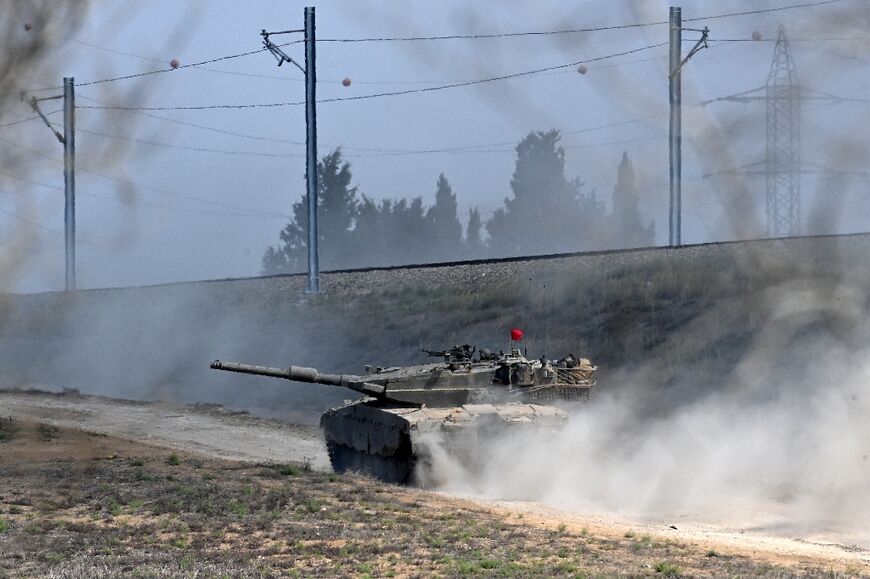 Israel has massed forces, tanks and other heavy armour around Gaza and called up 300,reservists as it vowed to destroy Hamas militants