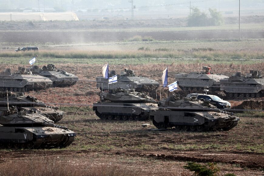 Israel has massed troops and heavy weaponry along the border with Gaza