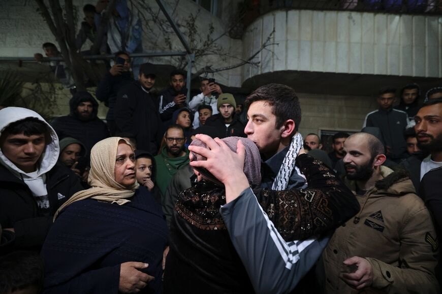 Palestinian prisoner Khalil Zama' hugs his mother after being released from an Israeli jail