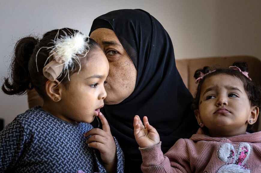 Mohammed Sabbagh's mother Eman with two of his children at the family home in Jenin