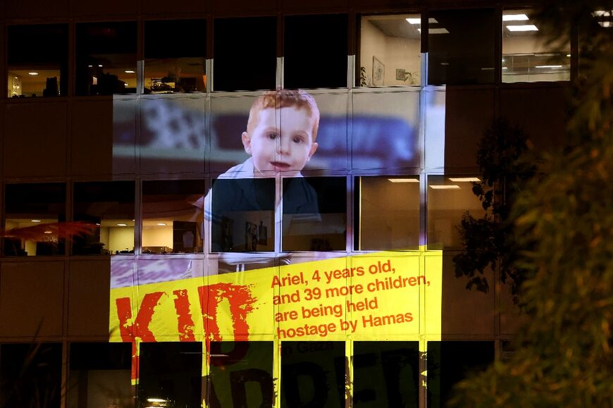 The image of hostage Ariel, 4, is projected during a rally outside the offices of the UN children's agency in Tel Aviv to demand the release of Israelis held hostage in Gaza 