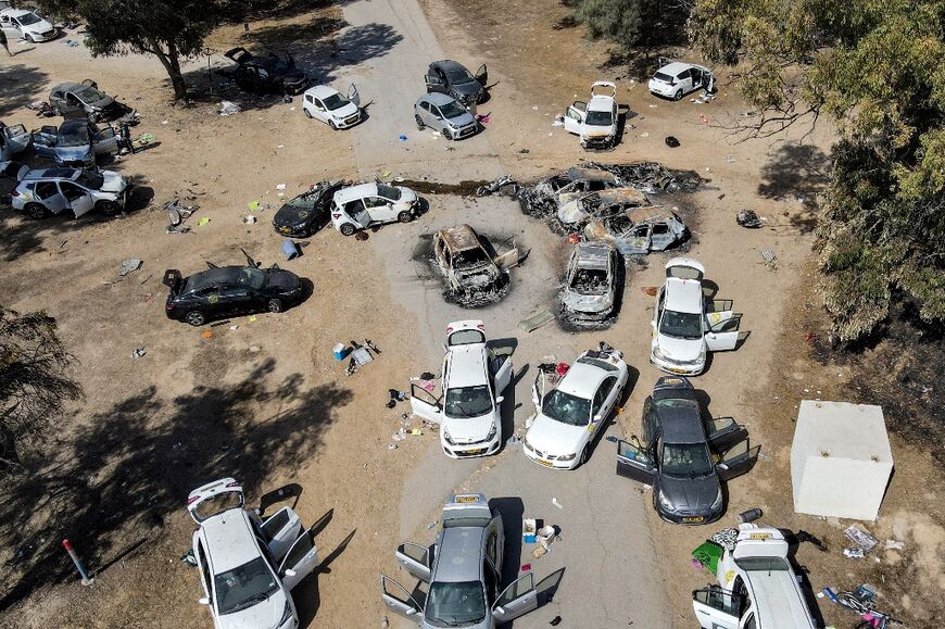 Abandoned and torched vehicles at the site of the October 7 attack on the Supernova desert music festival by Palestinian militants in the Negev desert in southern Israel