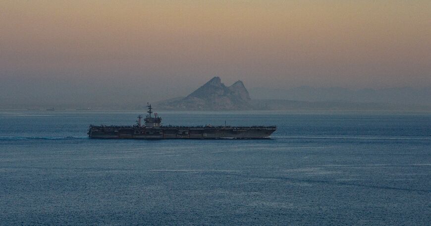 A photo obtained from the US Department of Defense shows the USS Dwight D. Eisenhower aircraft carrier transiting the Strait of Gibraltar on October 28, 2023