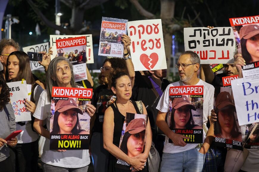 Relatives and supporters of hostages held in Gaza protest outside the defence ministry in Tel Aviv calling for a deal to be made by the Israeli government for the captives' release