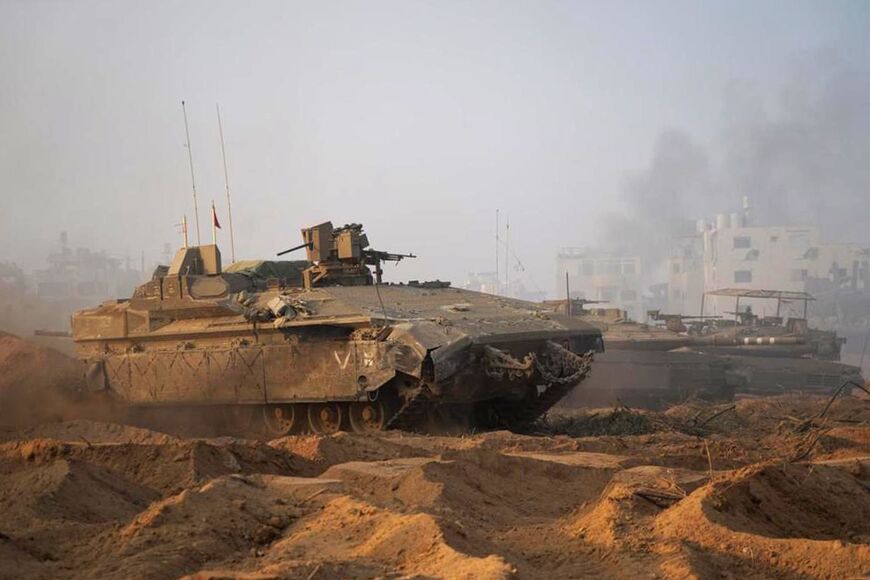 Israel has sent armour and infantry into the Gaza Strip and declared it had surrounded Gaza City