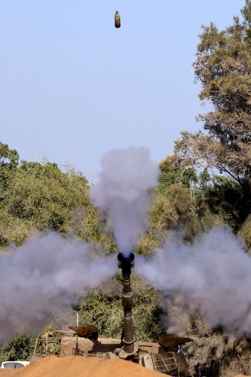 The Israeli army says it is using artillery, far from the front line, to support the advance of infantry and armoured units encircling northern Gaza
