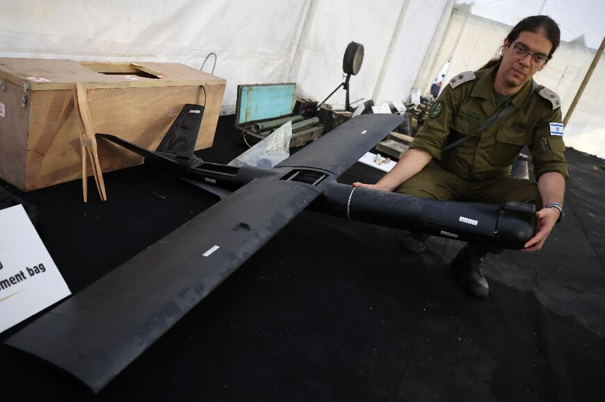 A picture taken during an official media tour organised by the Israeli military shows a soldier displaying a drone, allegedly recovered after the October 7, 2023 attack by Palestinian militants 