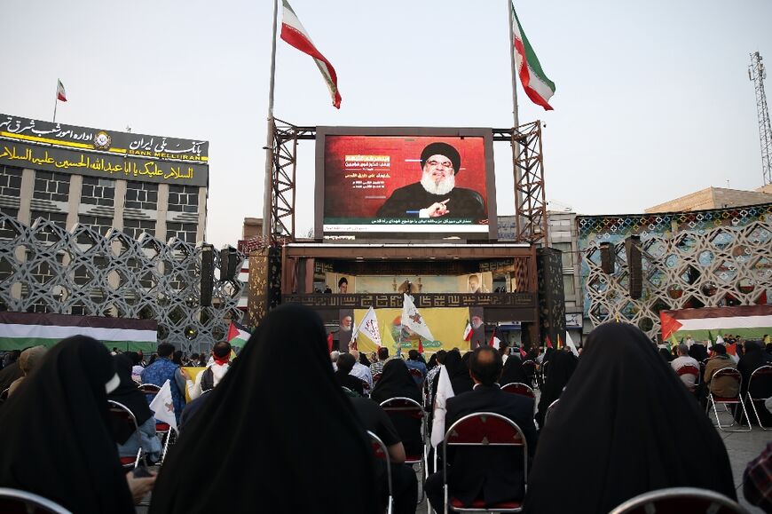 People gather to watch Nasrallah's speech in the Iranian capital's Imam Hussein Square