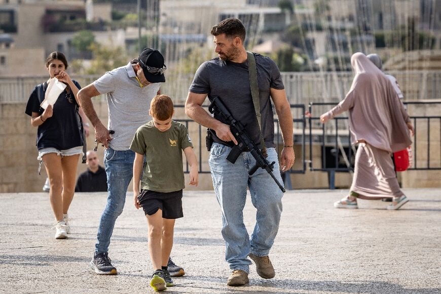 Tensions are high in the Old City, part of occupied East Jerusalem, with this off duty soldier choosing to go out armed.