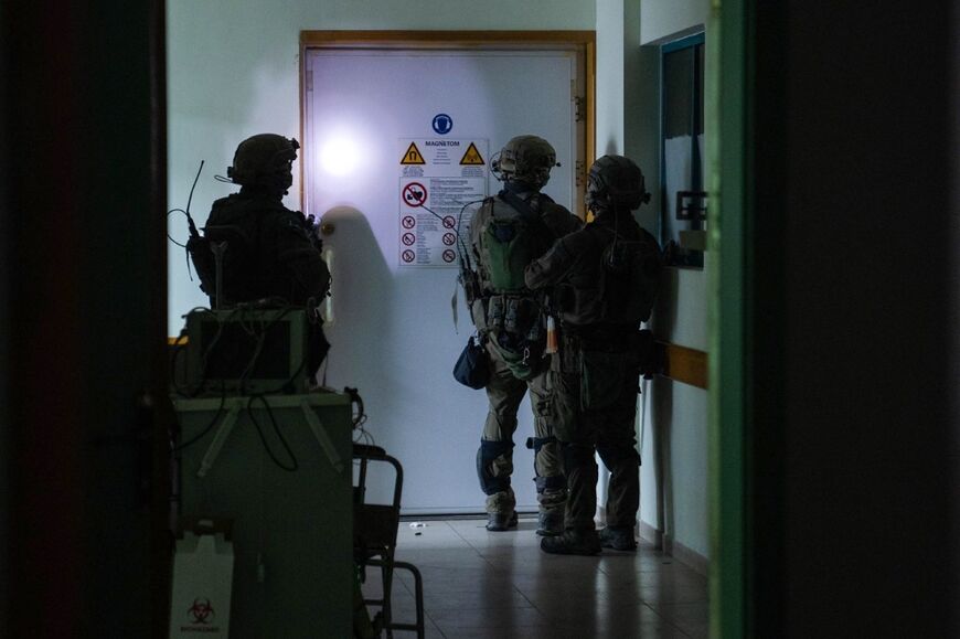 This picture released by the Israeli army shows soldiers carrying out operations inside Al-Shifa hospital