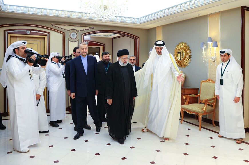 Qatar's Emir Sheikh Tamim bin Hamad Al-Thani (2ndR) alongside Iran's President Ebrahim Raisi and Foreign Minister Hossein Amir-Abdollahian in Riyadh
