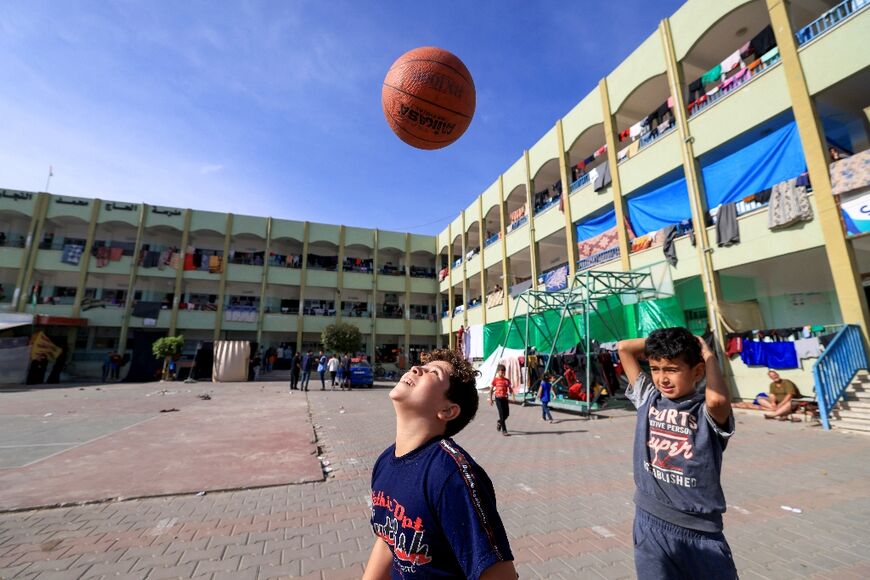 Still time for play: displaced Palestinian children who now live in a Khan Yunis school