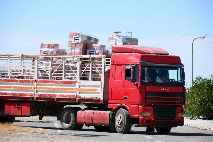 A truck on May 5, 2023 transports aid offloaded from a plane which arrived from the United Arab Emirates in Port Sudan