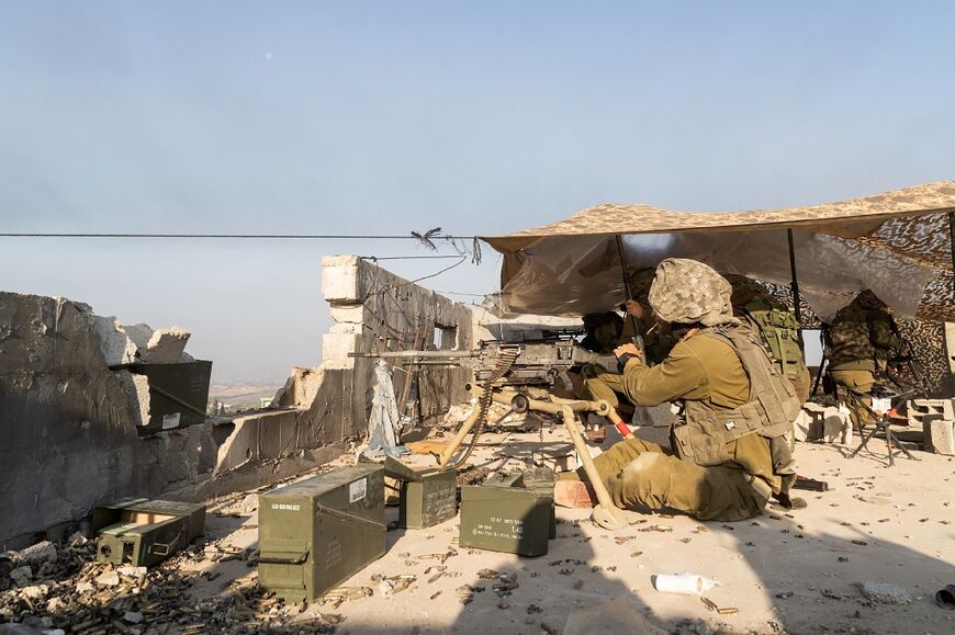 Israeli soldiers man a position in the northern Gaza Strip