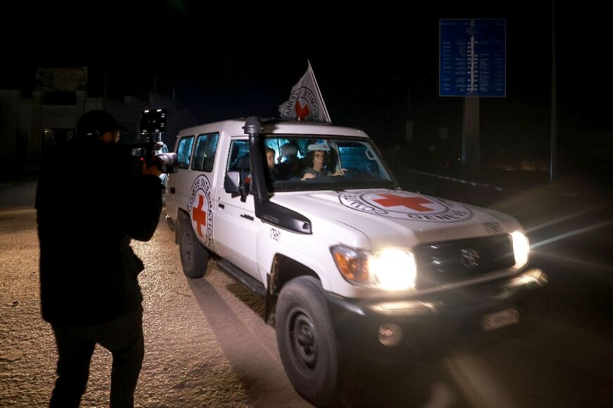 A Red Cross vehicle carrying Israeli hostages leaves Gaza late Thursday in what proved to be the last such release in a week-long truce