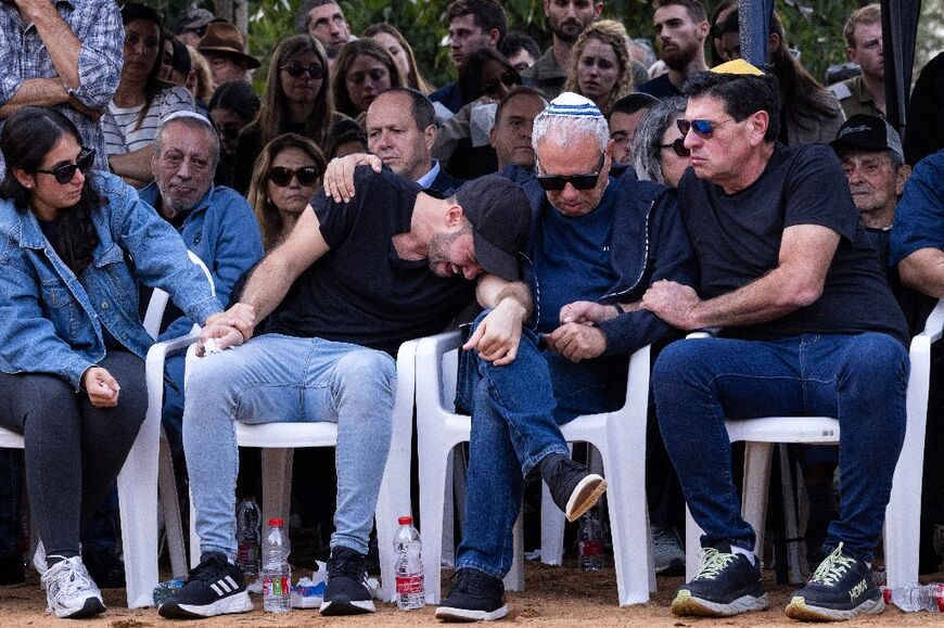 Relatives and friends, including the father Avi (2nd-R), mourn at the funeral of Alon Shamriz, one of three hostages mistakenly killed by Israeli forces in Gaza 