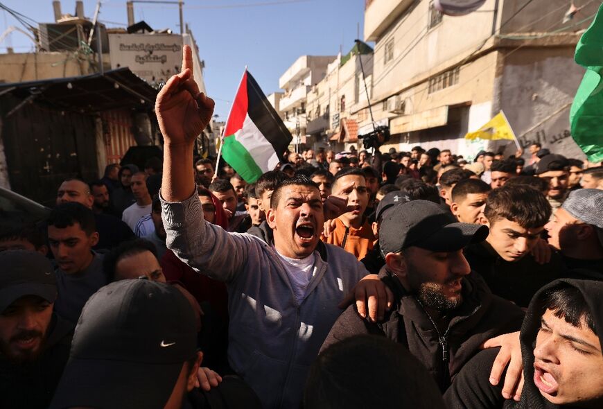 Mourners attend the funeral procession of two men killed in Fawwar refugee camp, south of Hebron in the occupied West Bank, where the Israeli army said it carried out a 'counter-terrorism' operation