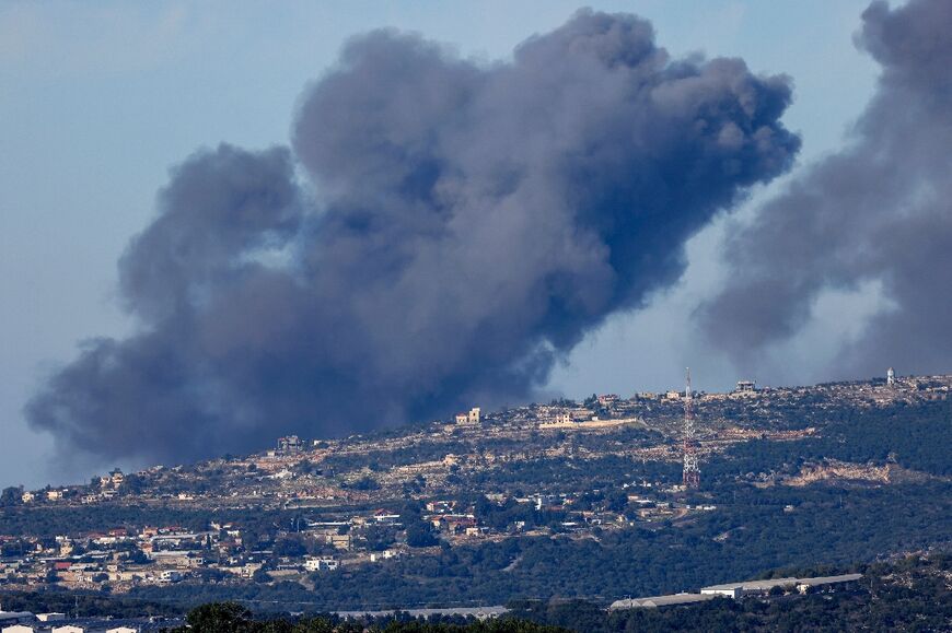 A picture taken from a position in northern Israel along the border with Lebanon, shows smoke billowing following Israeli bombardment on hills close to the town of Marwahin in southern Lebanon