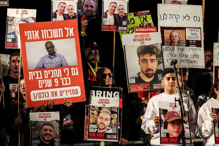Protesters in Tel Aviv show portraits of Israeli hostages on December 9
