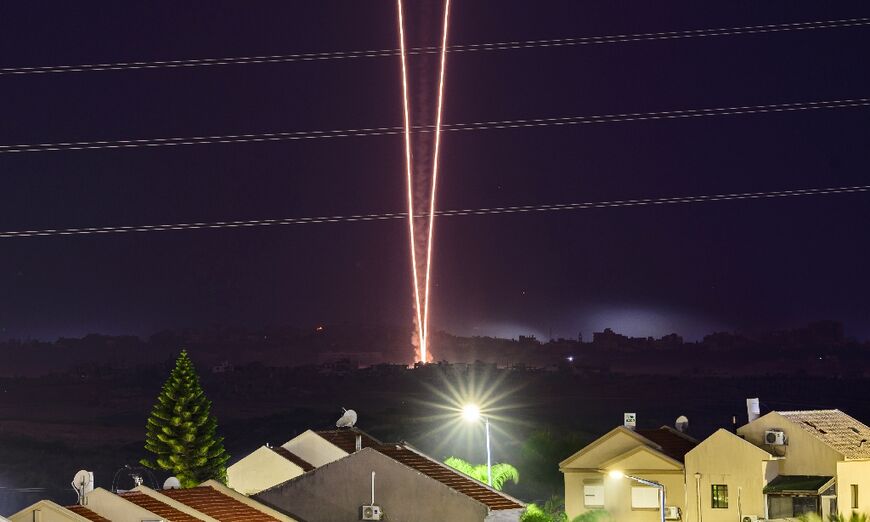 This long exposure picture taken from southern Israel near the border with the Gaza Strip shows rockets being fired towards Israel from north Gaza 