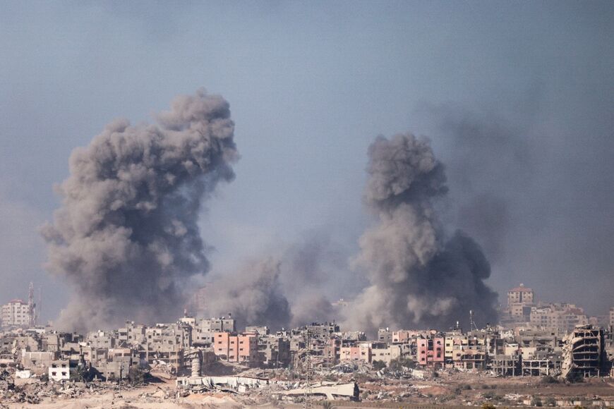 A picture taken from southern Israel near the border with the Gaza Strip on December 11, 2023, shows smoke billowing during Israeli bombardment 