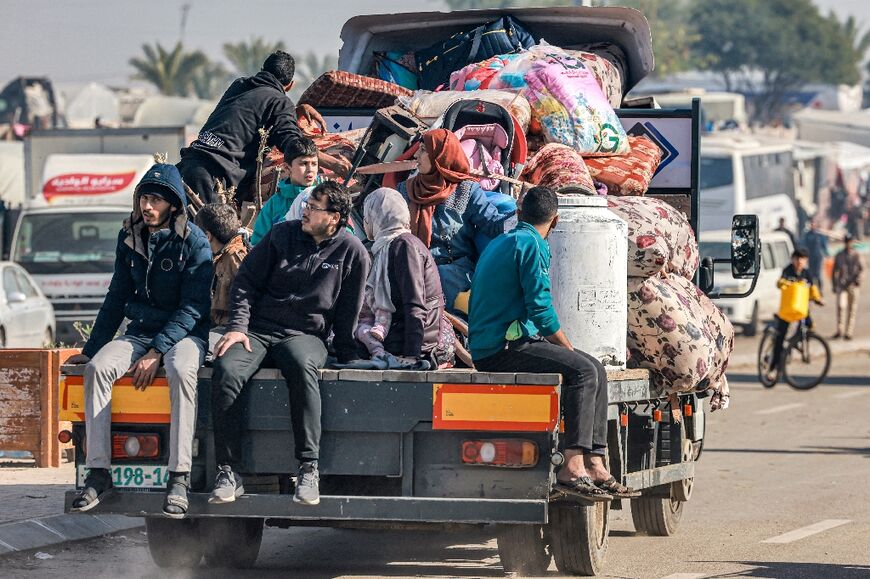 A truck carrying people fleeing from the central Gaza Strip after an evacuation order arrives in Rafah, at the territory's southern point