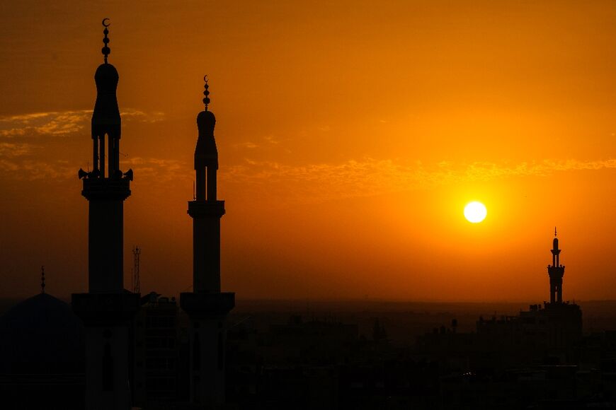 The sun sets in Rafah, the southern Gaza Strip, where many Palestinians have fled but Israeli air strikes have also hit