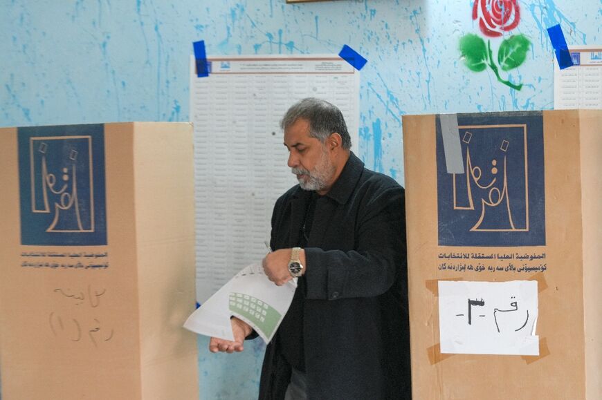 An Iraqi man votes in the first provincial council elections in a decade, at a polling station in the central city of Najaf