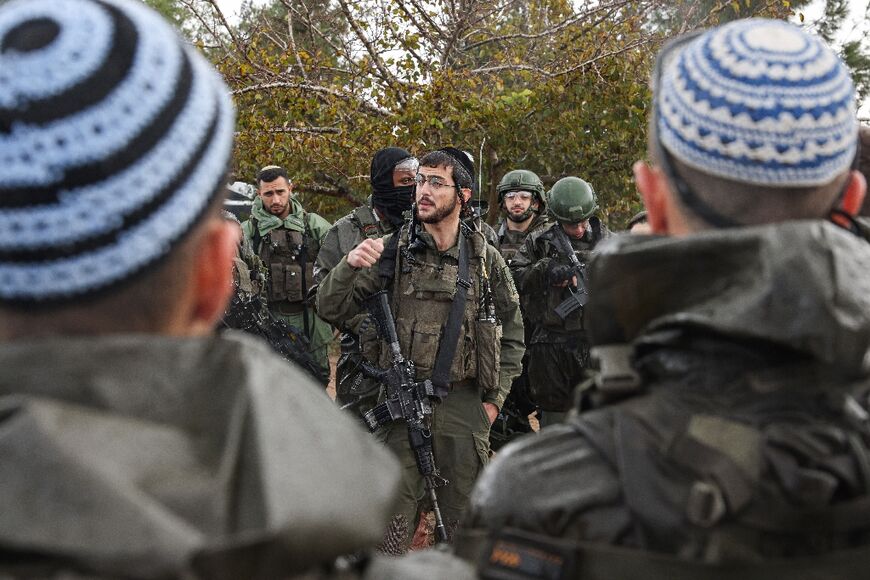 Israeli soldiers prepare to enter Gaza