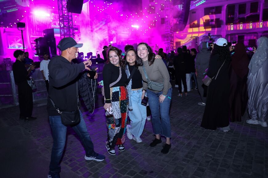 Balad Beast festival goers in Jeddah pose for pictures