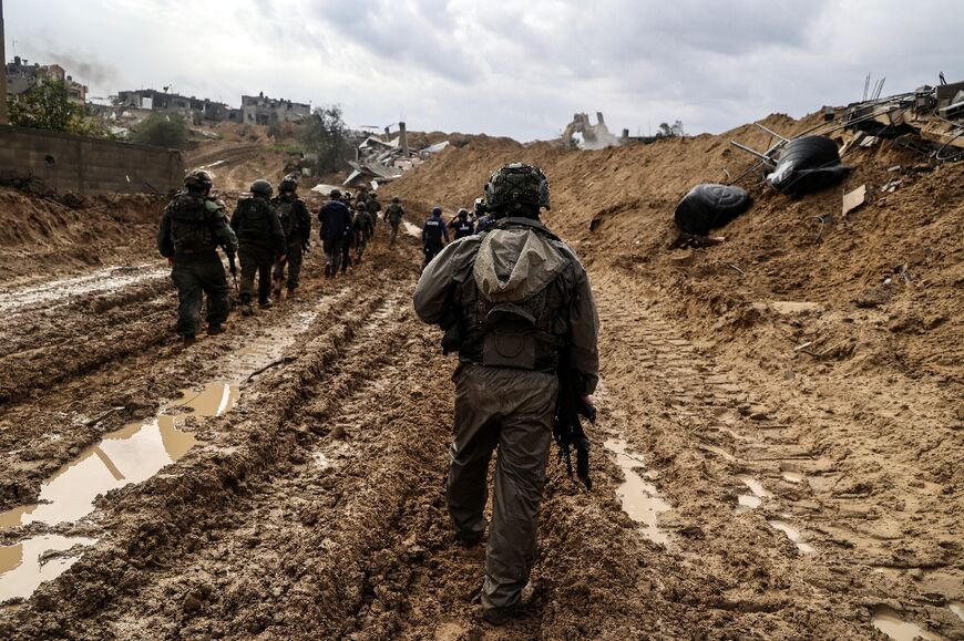 This picture taken during a media tour organised by the Israeli military on January 27, 2024 shows Israeli soldiers patrolling an area in Gaza's main southern city of Khan Yunis,
